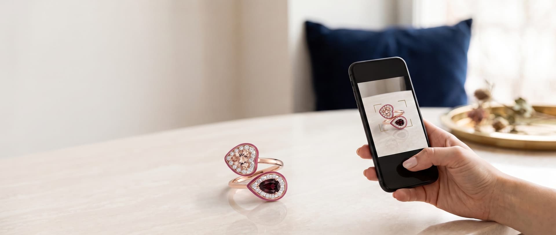 A phone camera pointed at a rose gold ring, showing it on the screen