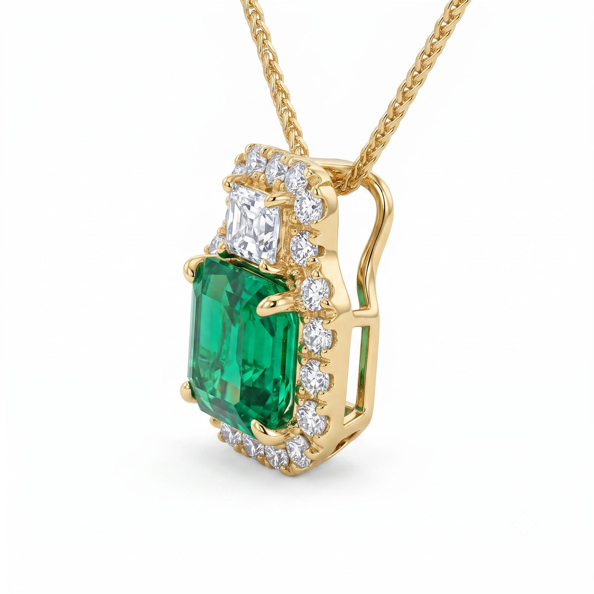 EP057051Y - Pendant 18KY/1.0G 1EMER-0.96CT 1DIA-0.20CT 21RD-0.19CT